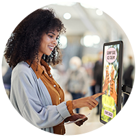 Woman using kiosk
