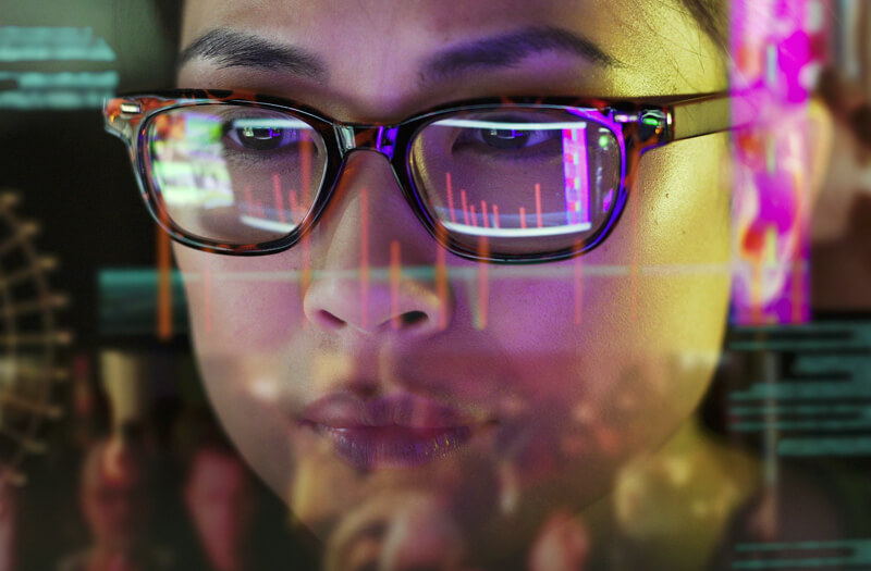 Engineer in glasses analyzing data analytics.