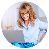 Woman smiling on laptop
