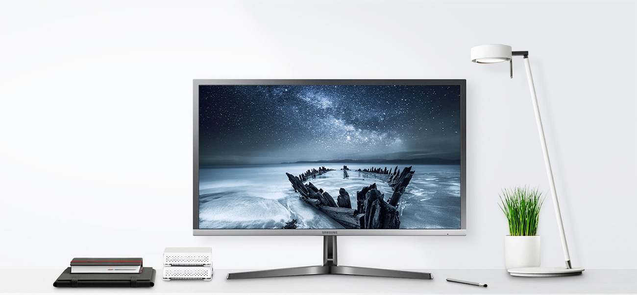 Samsung desktop monitor with accessories on the side