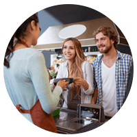 Young couple is able to pay with mobile device at cashier