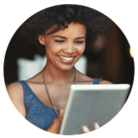 Smiling business owner uses tablet to create an Insight.com account