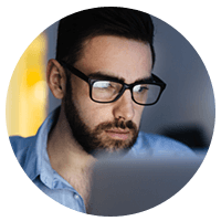 IT support professional views security licenses on laptop