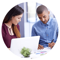 Two business professionals working together to find software solutions