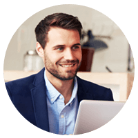 Smiling businessman on laptop computer