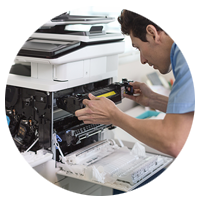 A printer technician checking out the HP Color LaserJet Enterprise Flow MFP M577z.