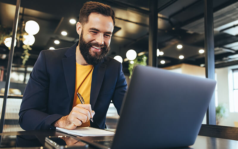 Business professional working on laptop device