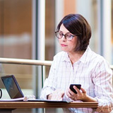 Finance & accounting CFO reviewing cloud based accounting reports offsite