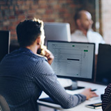 Office productivity applications Business team working collaboratively in open office environment