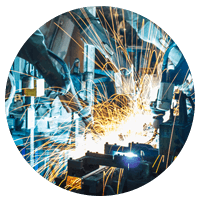 Industrial manufacturing sparks from equipment.