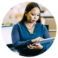 Business woman using tablet computer in office