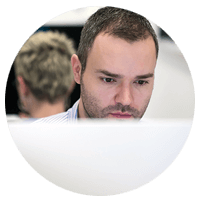 Software technician working at desktop computer