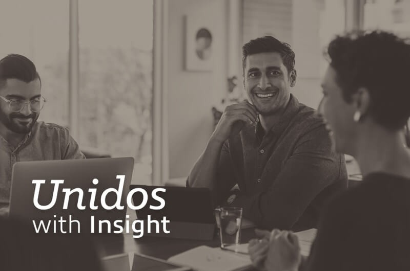 Smiling colleagues use up to date software to complete projects