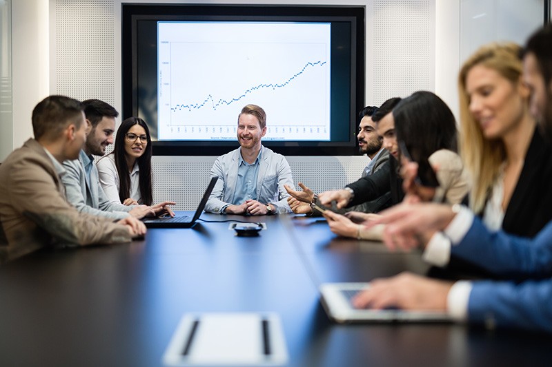 Gartner analysts provide insight that business leaders rely on. IT executives in business meeting discussing currency