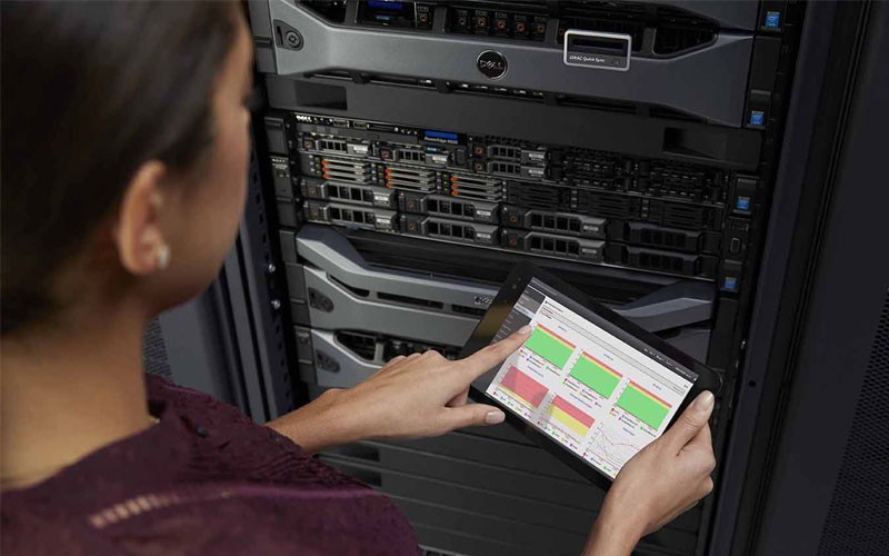 Server management software Dell employee using tablet in data center
