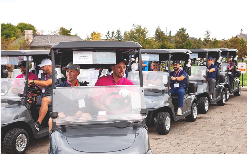 people riding golf cars