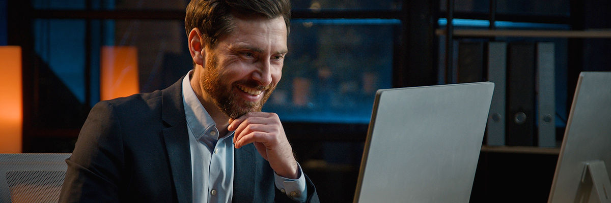 Save & Close A Vision for Canada’s Human Led AI Future Man smiling while using computer