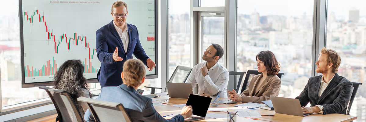 People in a meeting looking at data.