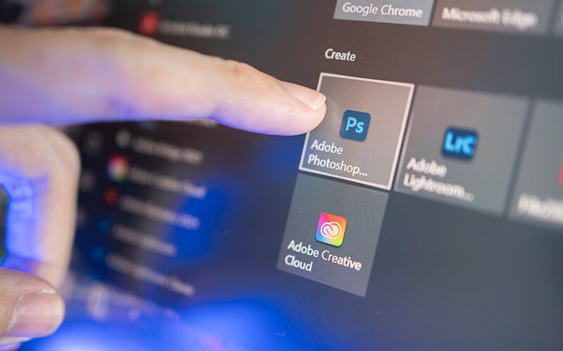 Solutions for your evolving workforce finger clicking Adobe Photoshop