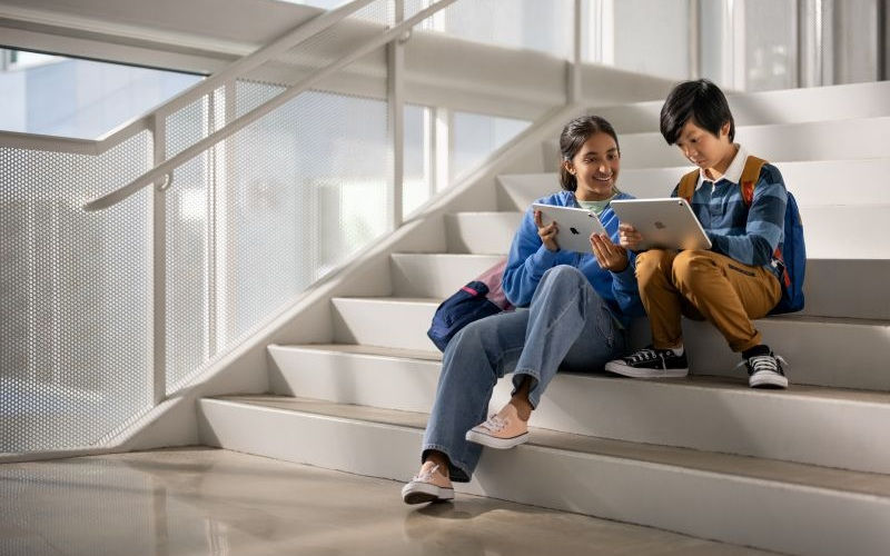 students using ipad while sitting