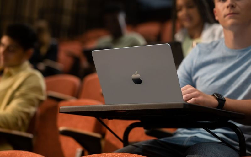 student using mac while in class