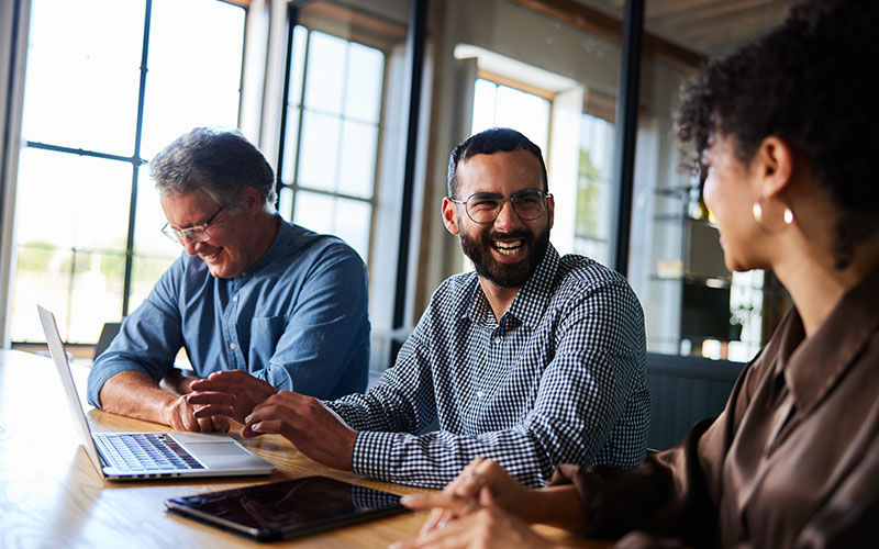 teammates smiling in office