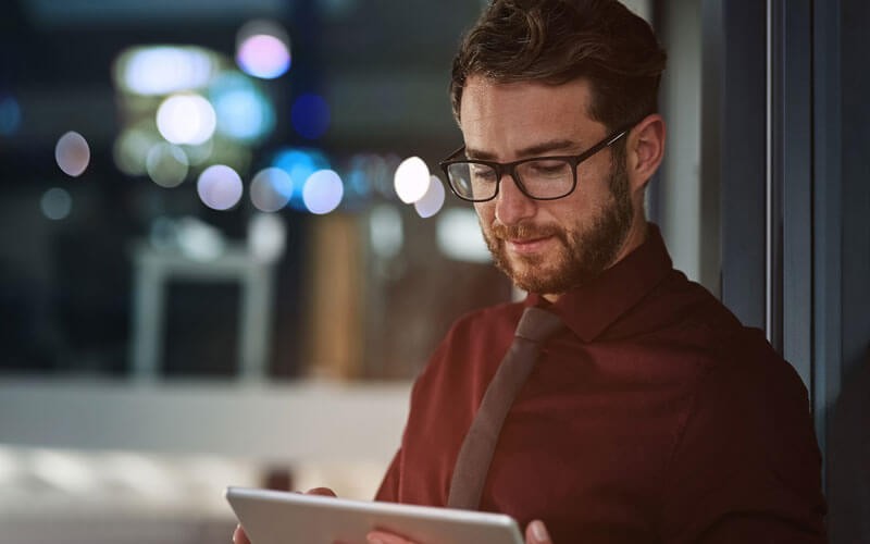 Man holding tablet device