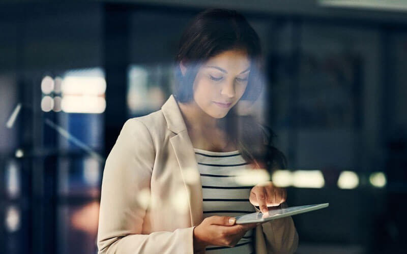 Woman working on tablet device