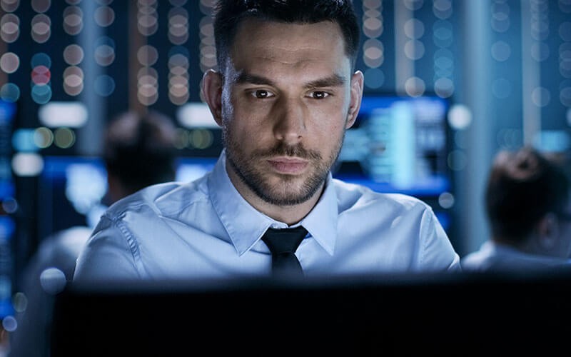 Man looking at monitor screen