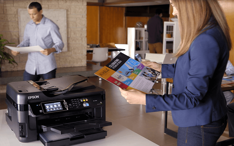 Woman working at Epson printer in open office