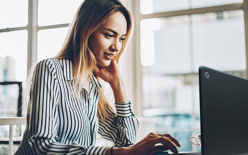 Woman using chromebook