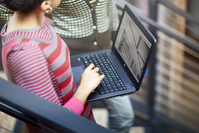 Woman uses a HP ZBook 14G2 Mobile Workstation.