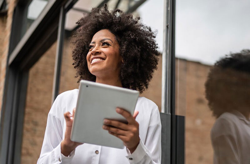 woman holding tablet