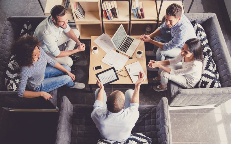 Team collaborating in open office space