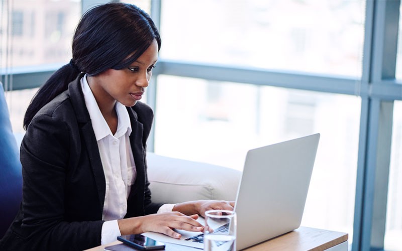 business-woman-typing-on-laptop