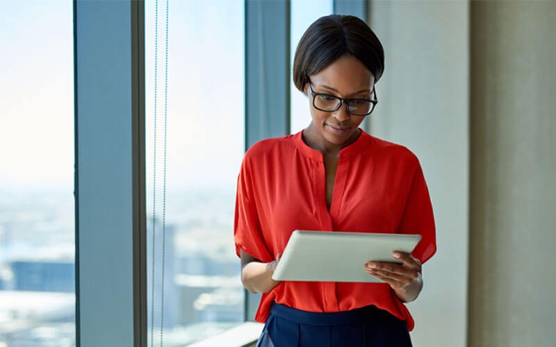 A business woman working productively using her tablet