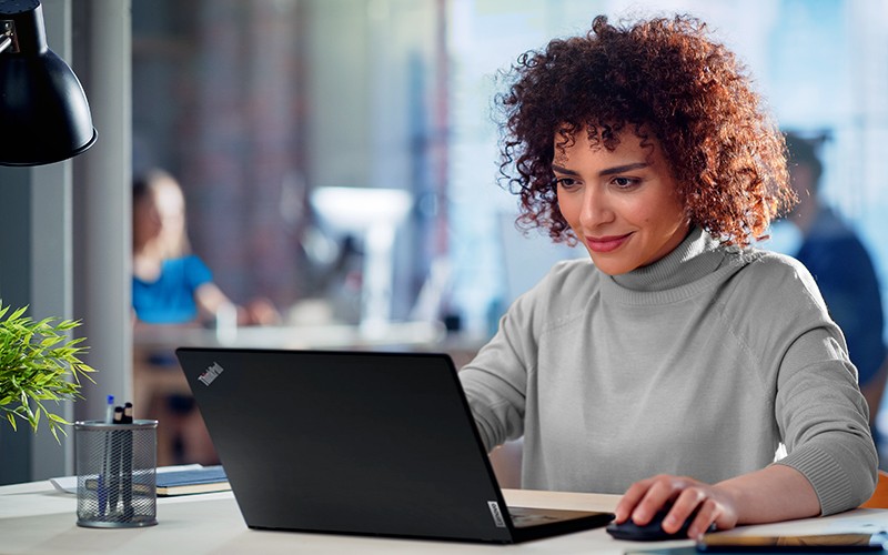 young curly woman working office lenovo laptop