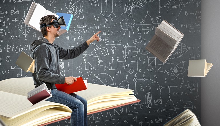 Student using VR headset to immerse themself in a book. 
