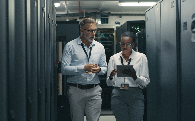 two engineers walking through server room