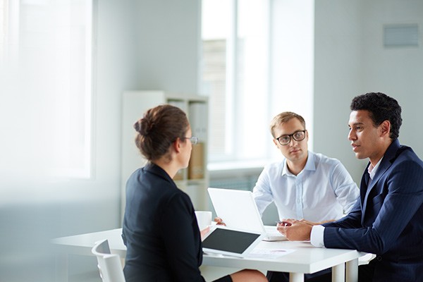 business-team-discussion-laptop-tablet