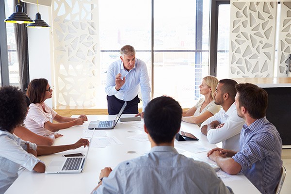 businessman-talking-with-team