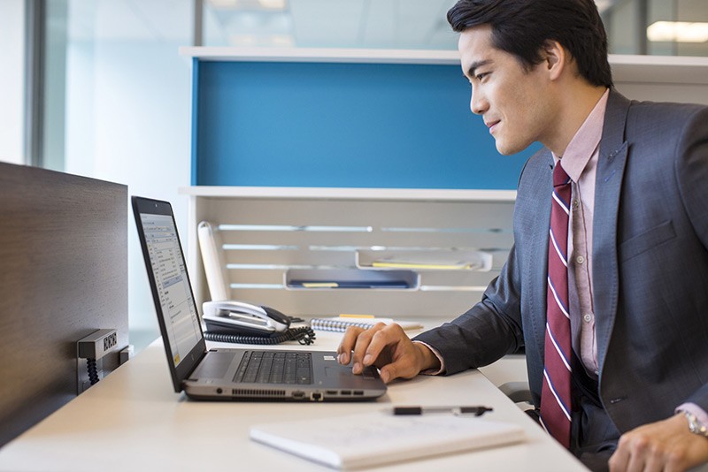 Smart choice for businesses of all sizes Businessman in cubicle working with an HP ProBook 470