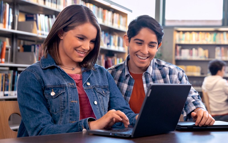 Digital classroom with Microsoft apps Three students working on project