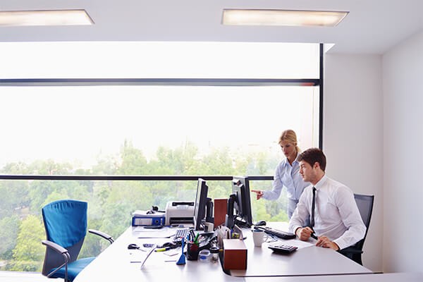 Modern solutions Man and woman collaborating on a computer