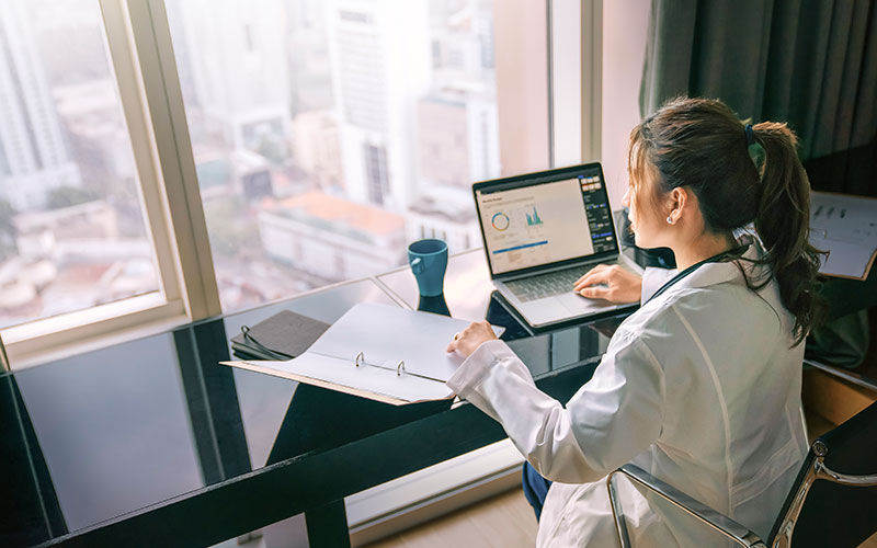 woman working beside window