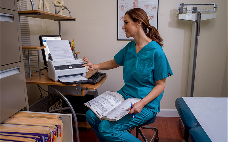 Epson print solutions for every industry Healthcare woman printing using Epson printer