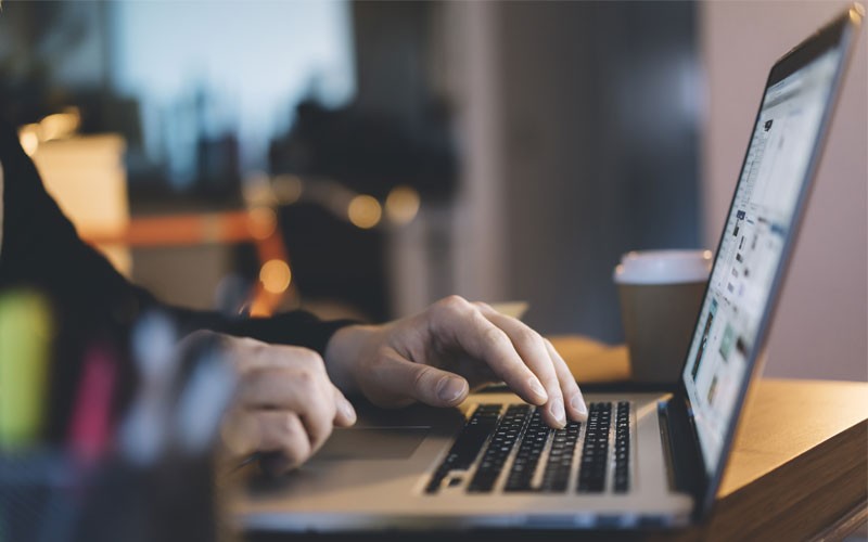 Hands on keyboard using laptop device
