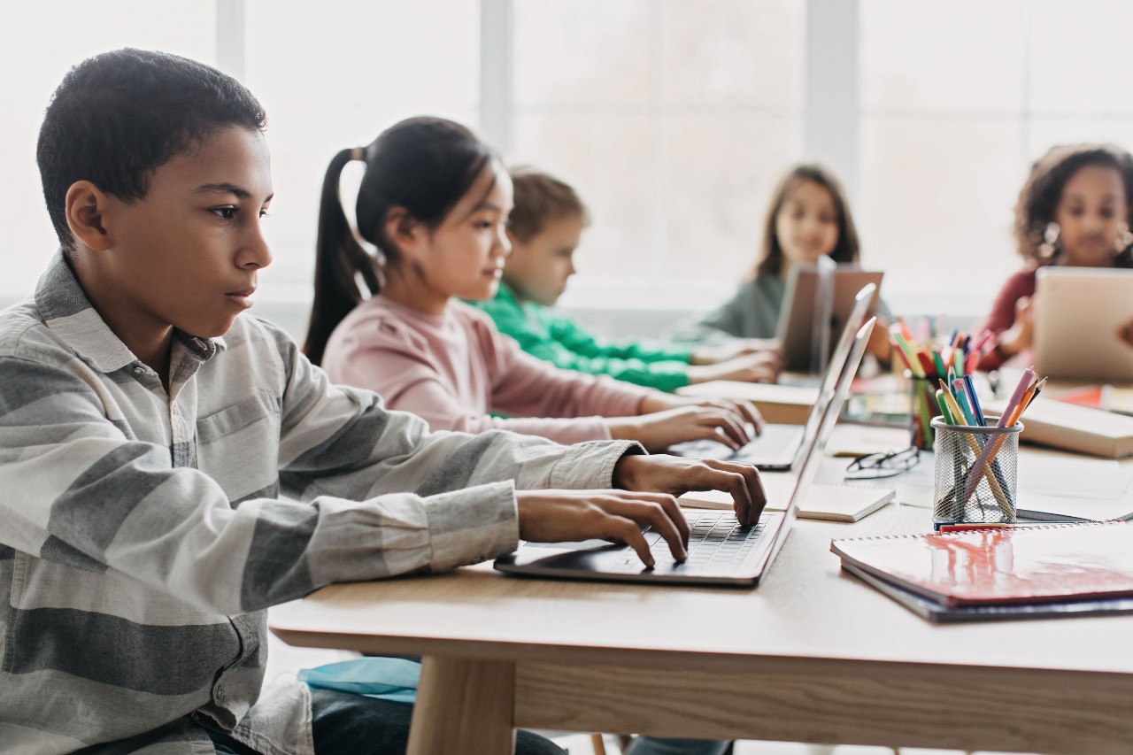 Kids using laptop during class