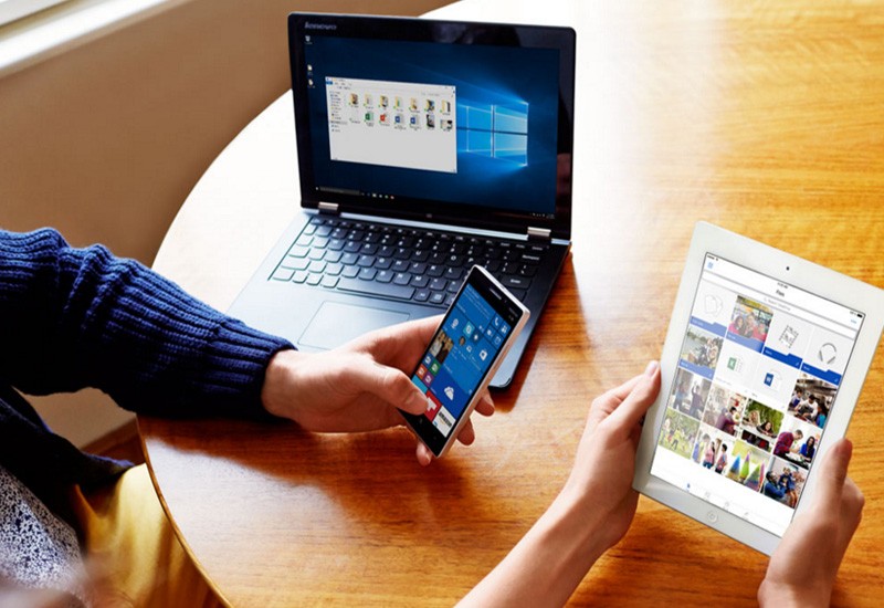 Microsoft OneDrive allows you to access your files from any device, anywhere. Microsoft OneDrive displayed on notebook, smart phone and tablet devices
