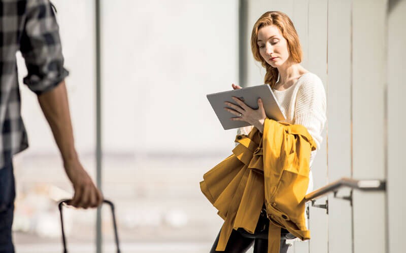 ms-woman-working-on-surface-in-airport-traveling